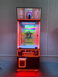 claw machine  with advertising screen featuring collectible figurines and electronic games.